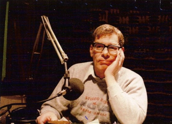 Bob Gallico seated at a studio microphone